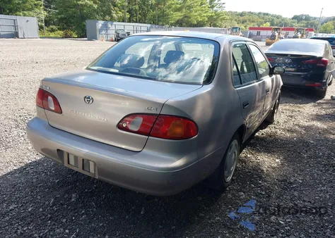 1999 Toyota Corolla Ce from USA, damaged, VIN 2T1BR12E1XC141396